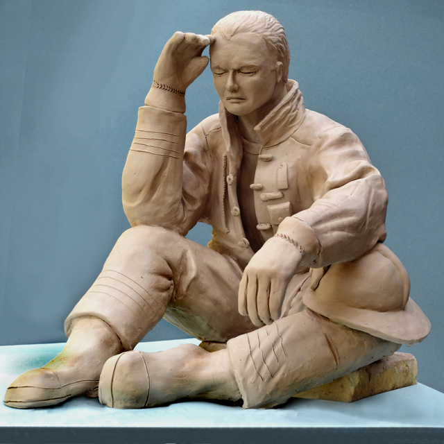 Fireman memorial sculpture grief exhaustion aftermath of emergency lifelike hero