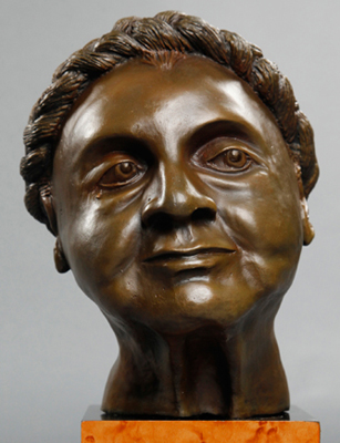 Classic bronze sculpture of older woman showing her mood of acceptance
